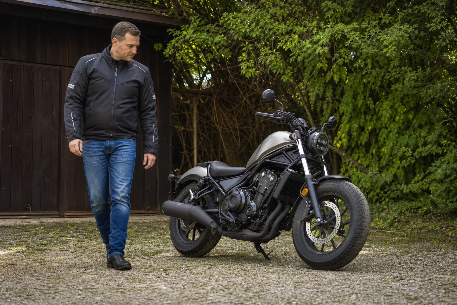 Rider visually checking a motorcycle before returning it to use.
